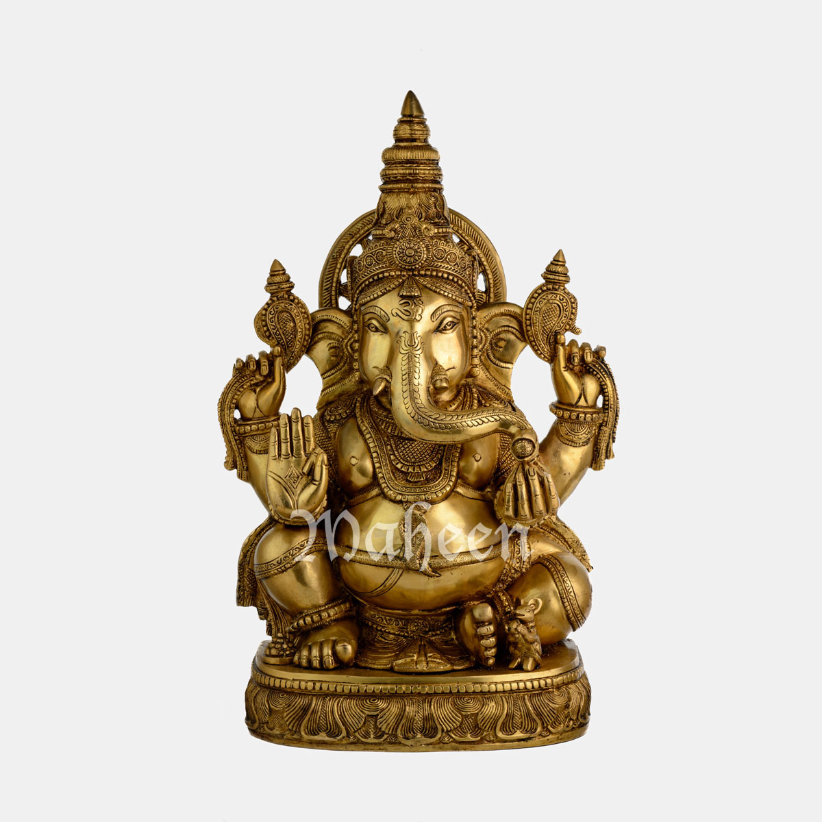 Brass Ganesha – With Ornate Head Work, Seated On Oval Carved Base